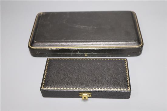 A George V cased pair of silver serving spoons, Sheffield, 1921 and a cased silver christening pair, 5.5oz.
